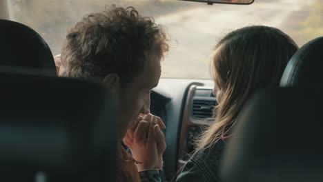 young couple inside a car