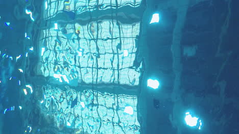 under the water of an indoor swimming pool