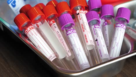 blood collection tubes, batch of unused specimen collection tubes, red caps and purple cap, blood tubes, blood donor