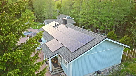 drone ascending in front of a sunlight energy driven self-sustainable house