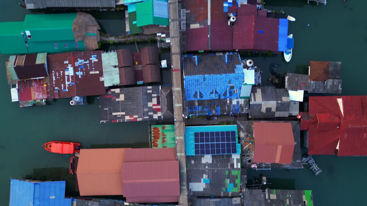 Aerial view of the colorful stilt houses of bang bao pier in koh chang, thailand, showing poverty and overpopulation. Nice aerial view flight vertical bird's eye view drone