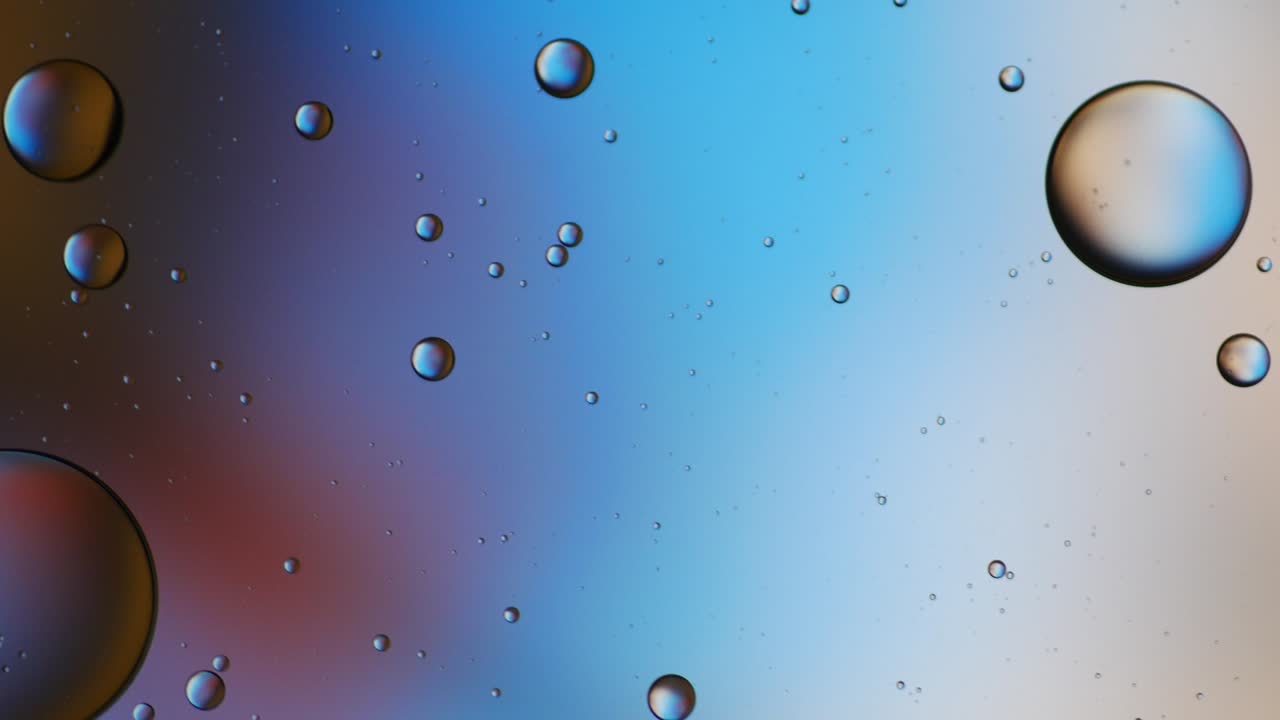 Colorful artistic of oil drop floating on the water.