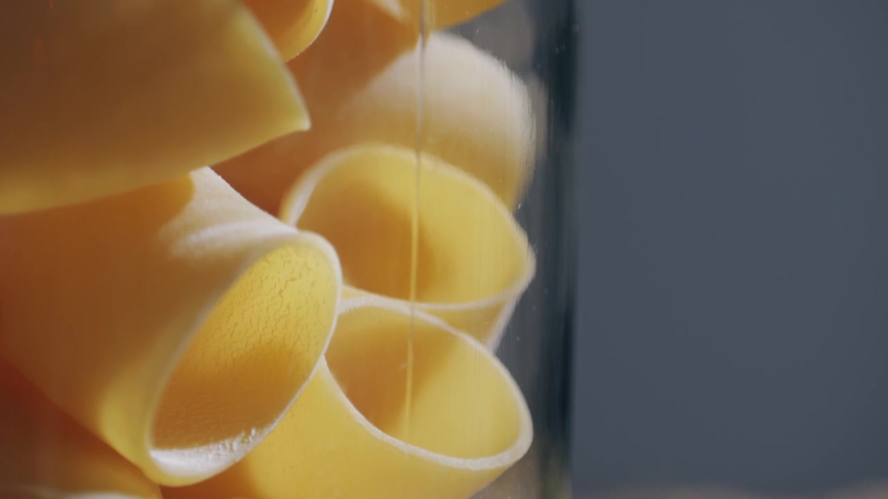 Close-up of Dry Italian Pasta Stored in a Glass Jar