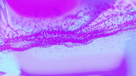 purple particles forming abstract waves, animation over gradient background