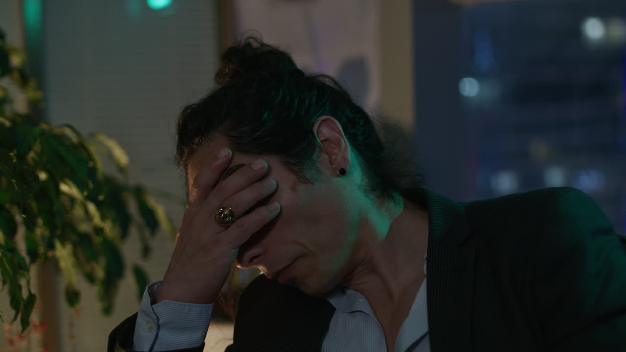 Man in Office During Phone Call and Stressed