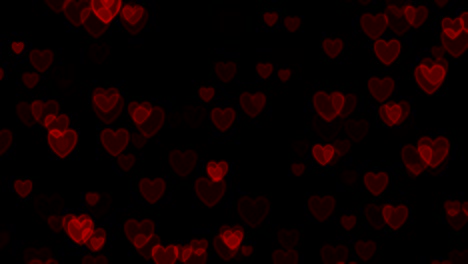 corazones rojos sobre fondo negro