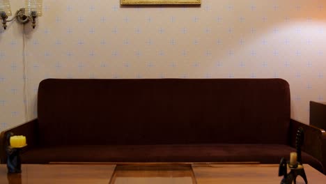 man sitting on a sofa in a living room