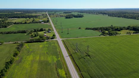 overhead power lines and countryside road in rural