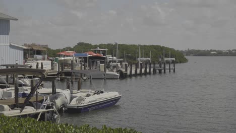 footage of a boat dock in a calm harbor on a beautiful sunny day