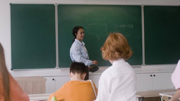 Teacher and students at the end of the class.