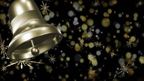 gold ringing christmas bell over snowflakes and light spots on black background