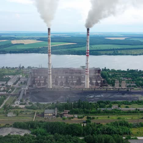 Plant pipes pollute atmosphere. Pollution of the environment of factory pipe with smoke