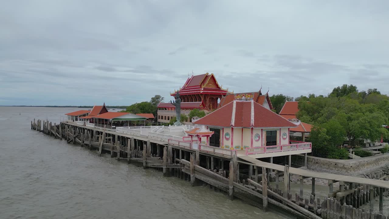 Coastal Thai Buddhist temple perched on a small islet surrounded by the sea