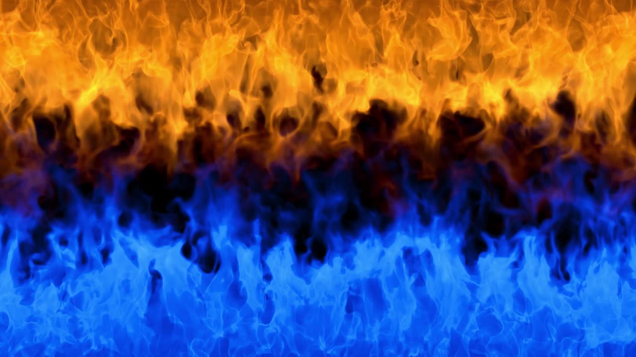 Fire flames on black background. Burning fire flame. Abstract background on the theme of fire, light and life. Fiery orange blue glowing. Strong fire. Big burning bonfire. Burning fields. Loop 4K