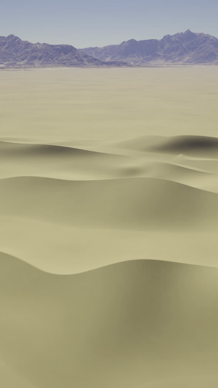 Expansive desert landscape with gentle sand dunes and distant mountains