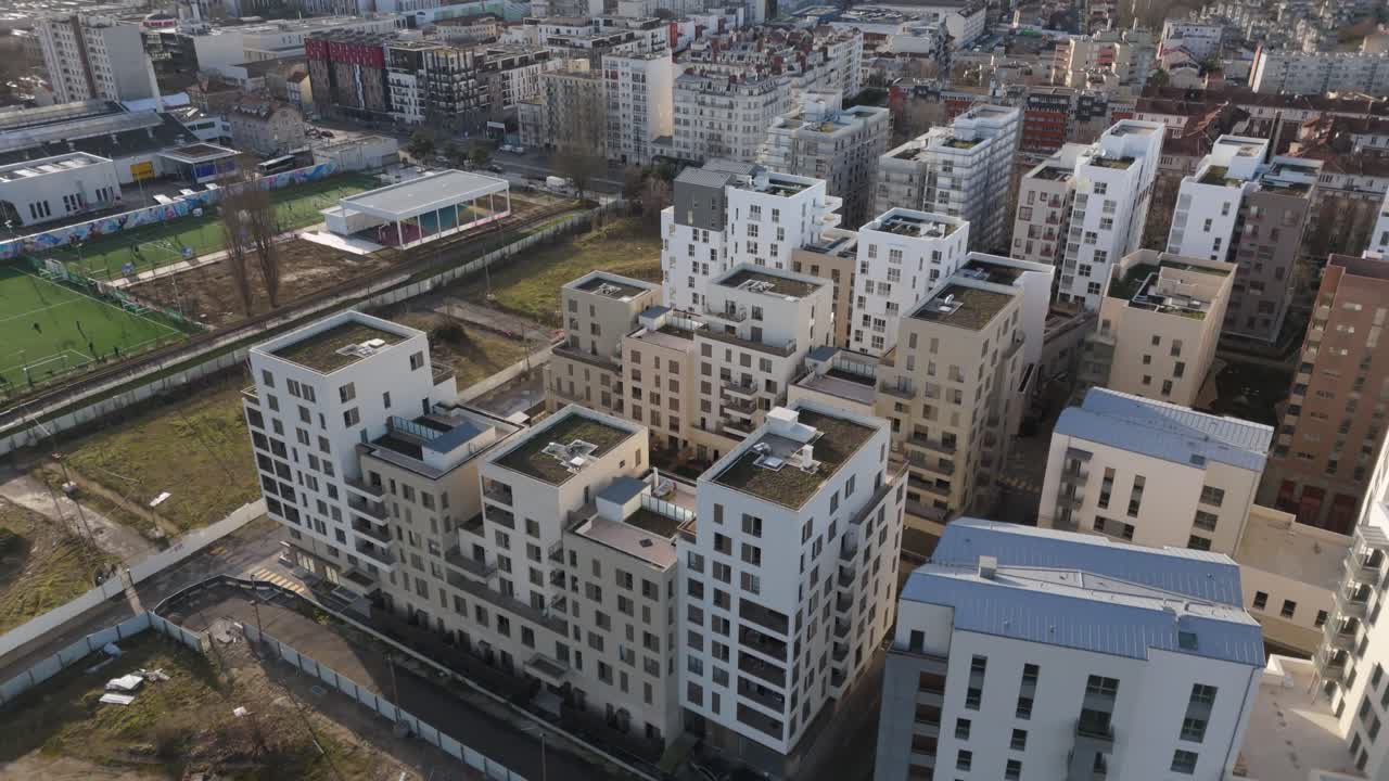 Modern urban development in Fort d'Aubervilliers, Paris, France. Aerial top-down backward