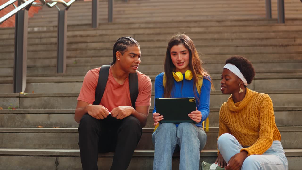 College Students on Stairs with a Tablet