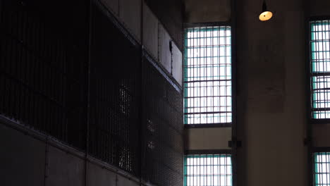 Alcatraz-Prison-Detail,-Big-Outdoor-Wall-Windows-With-Metal-Bars-and-Prison-Cells-in-B-Block,-California-USA