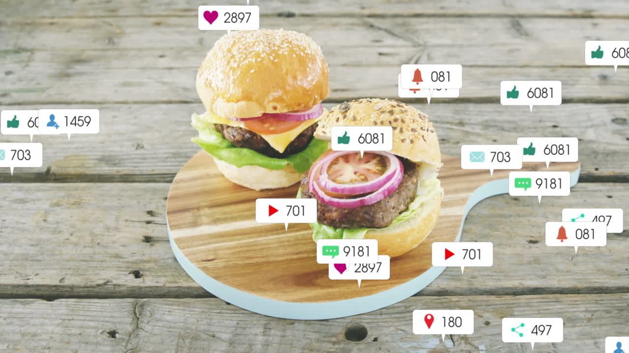Burgers on wooden board with animation of social media interaction icons