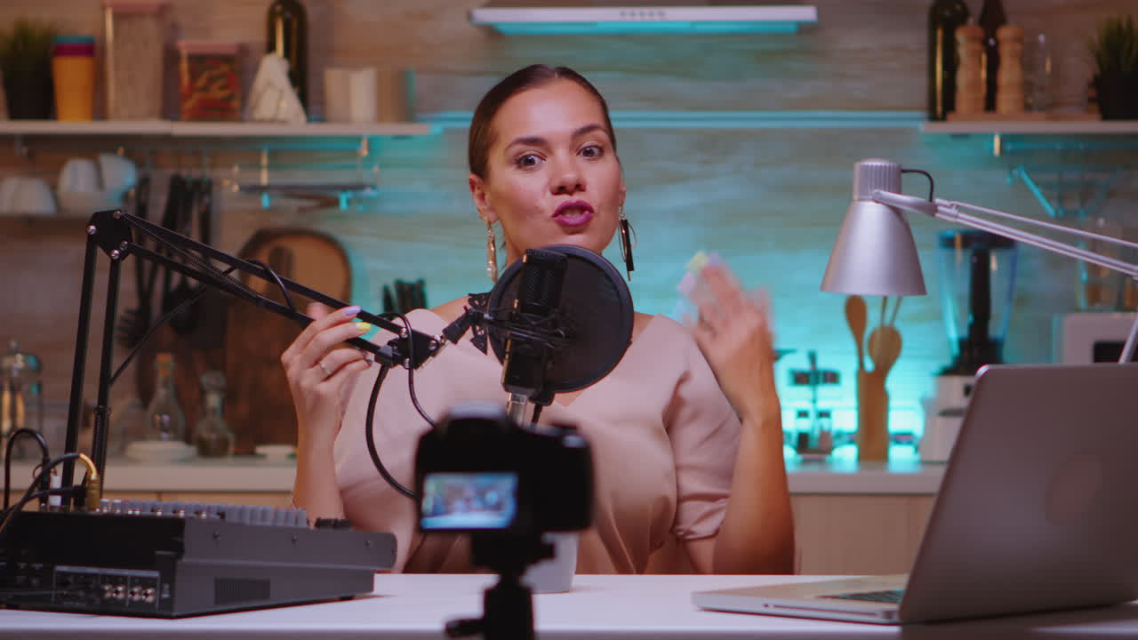 Blogger waving at camera