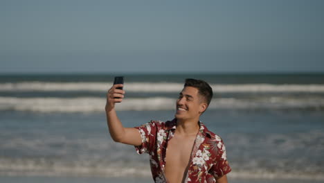 guy smiling at the beach