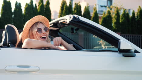 woman enjoying a drive in a convertible car