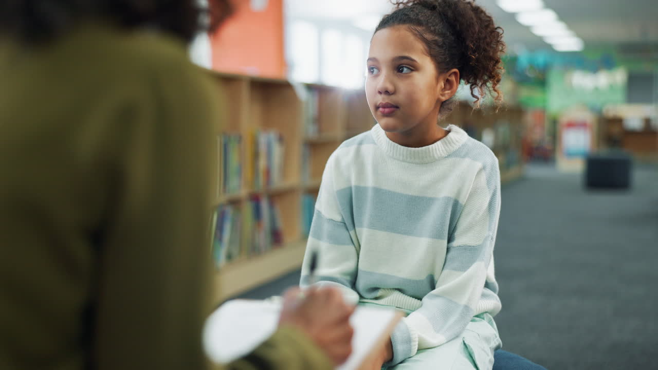 Girl in therapy session in school library