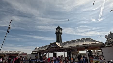 crowds enjoy a sunny day at the pier