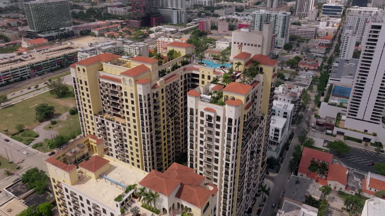 Aerial View of Luxury Residential High-Rise Buildings with Rooftop Pool in an Urban Setting