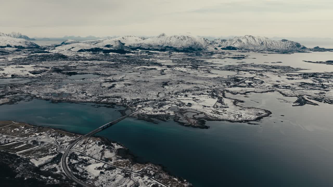 Flesveien Brua - Flesveien Bridge With Snowy Mountains From Offersoykammen, Leknes, Norway. - aerial shot