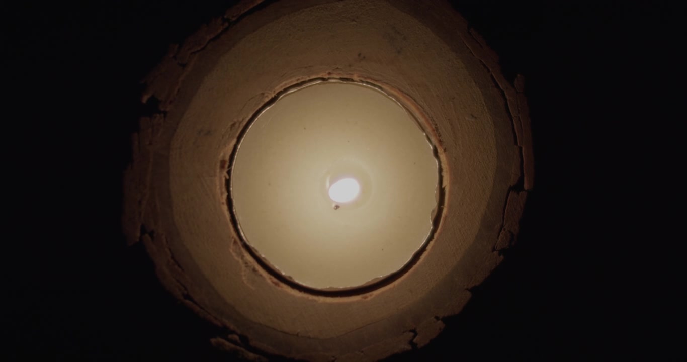 Top down shot of a single candle burning