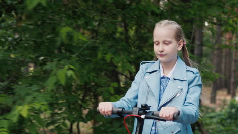 Side-View-Of-A-Girl-Riding-An-Electric-Scooter-On-The-Way-To-The-Park