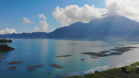 aerial footage of danau batur lake and active volcano mount batur