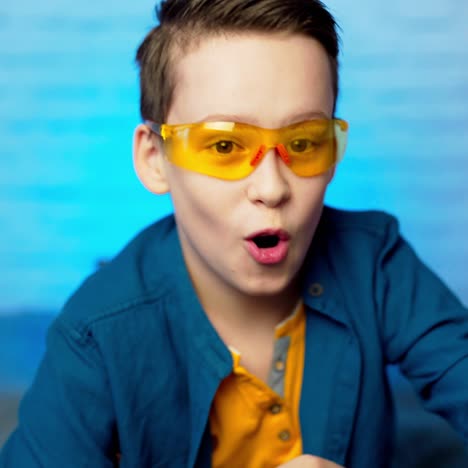 young boy as doctor wearing protective glasses