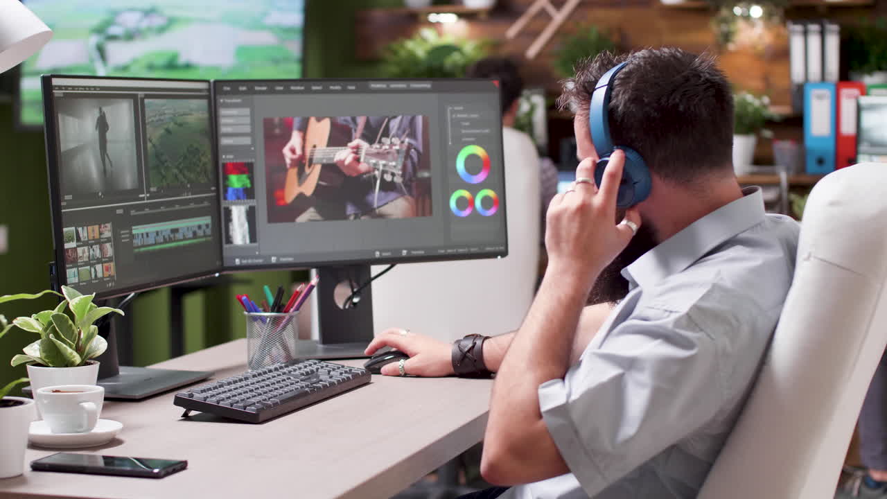 Man editing video at workstation