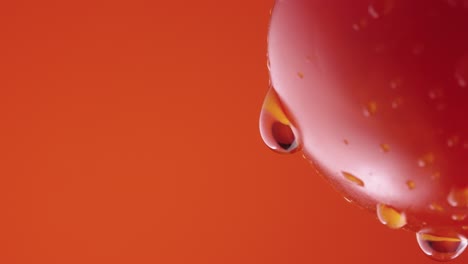 water droplets on a red tomato