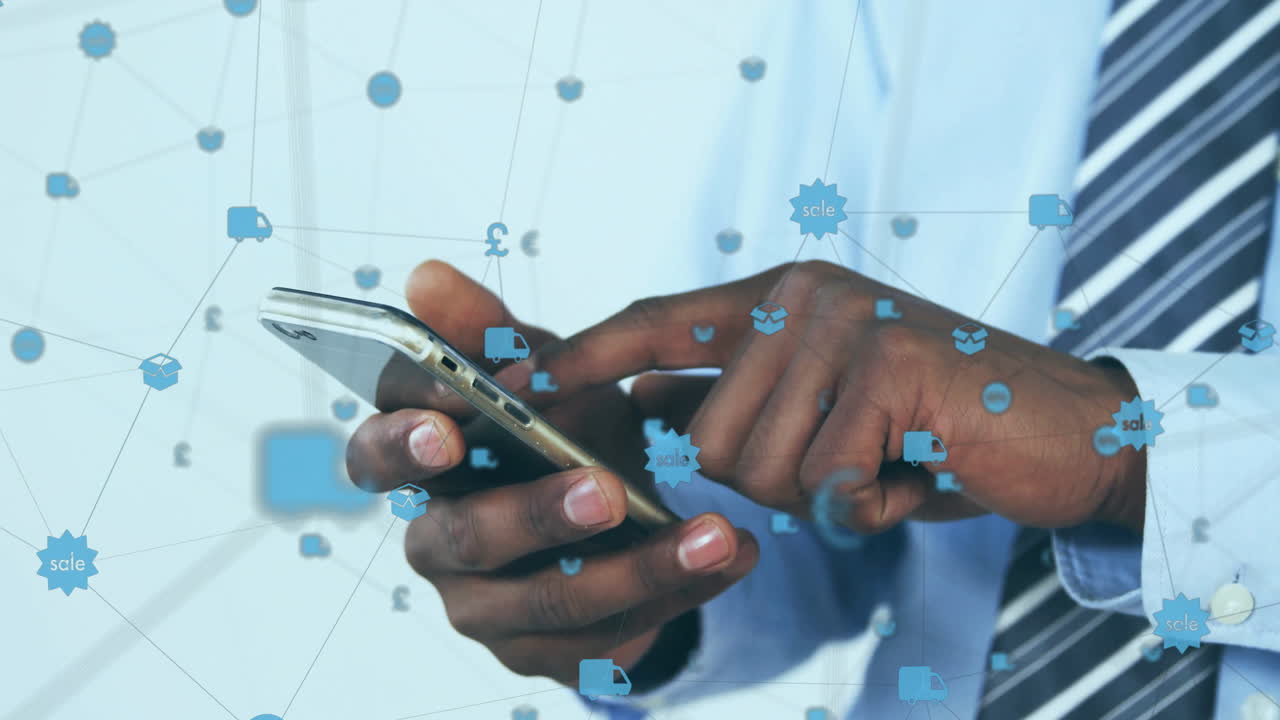 Animation of globe of connections with icons over afrcian american businessman using smartphone