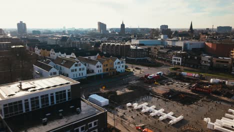 Aerial-hyperlapse-showing-buildings,-cars-and-city-landscape