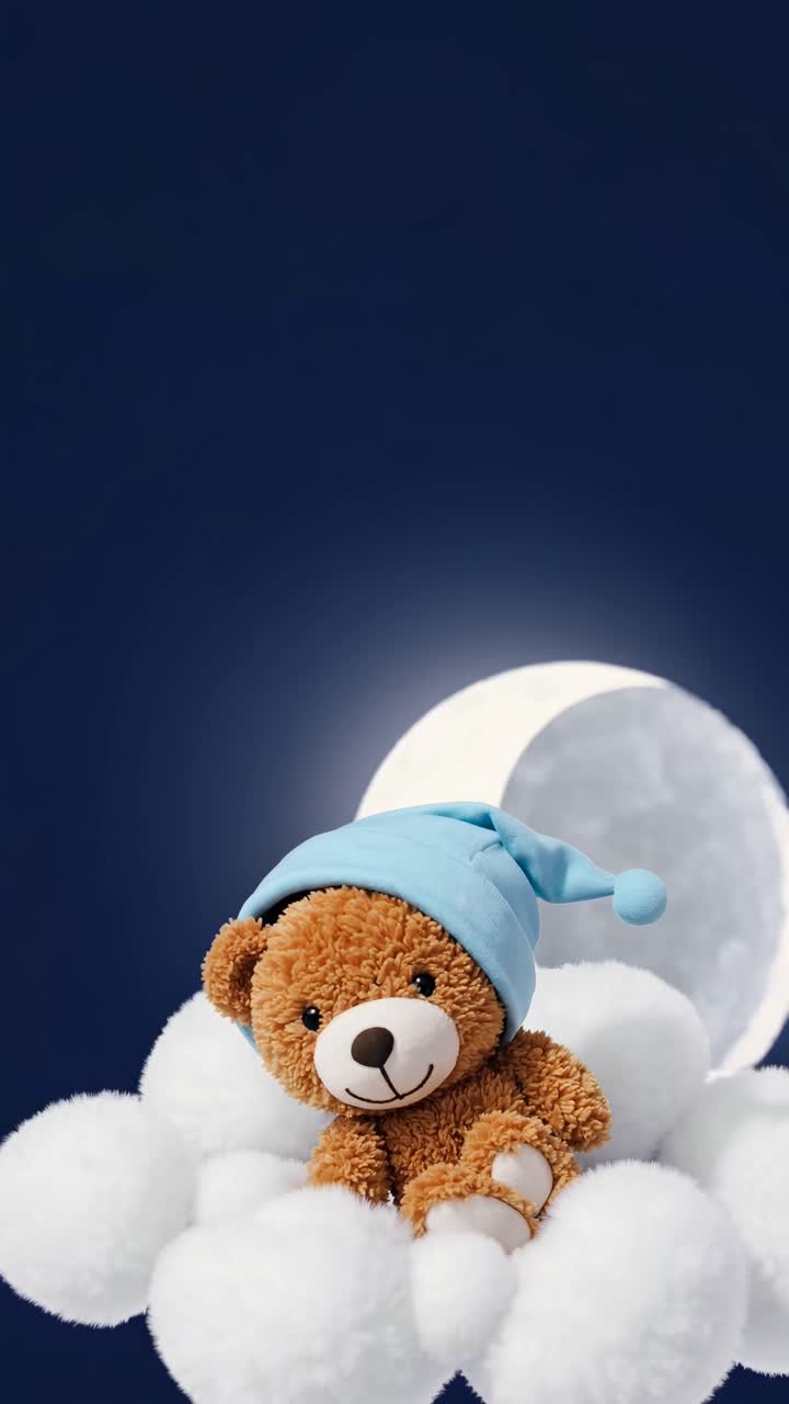 A plush teddy bear in a blue hat sits on fluffy clouds under a full moon