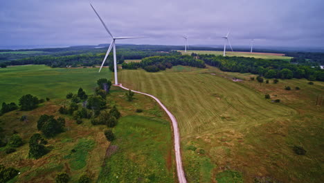 drone captures a panoramic view of a countryside dotted with wind turbines in northern michigan.