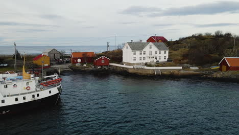 boat moored on the harbor near stromsholmen maritime sports center by atlanterhavsvegen in norway