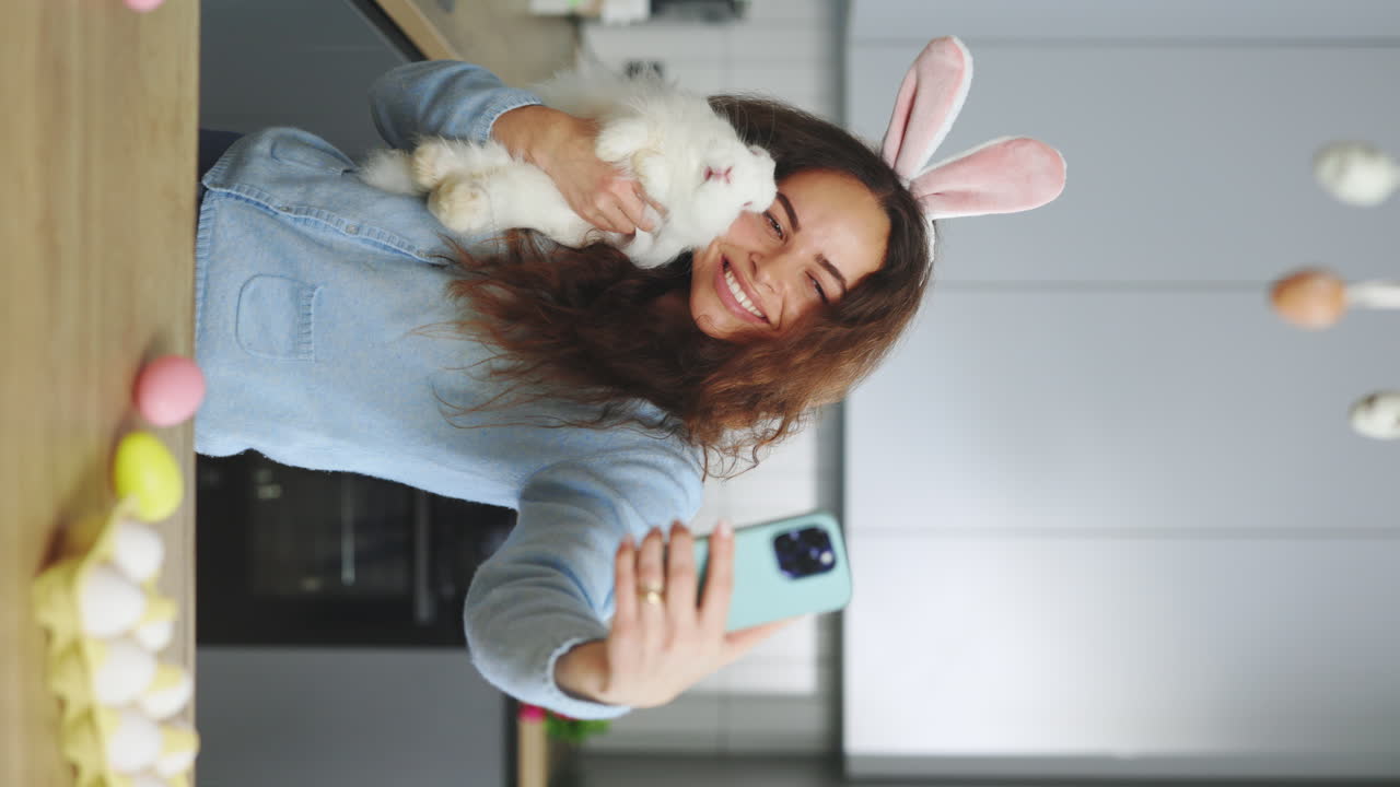 Woman Taking a Selfie with a Bunny for Easter