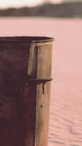 old rusty bucket on the beach