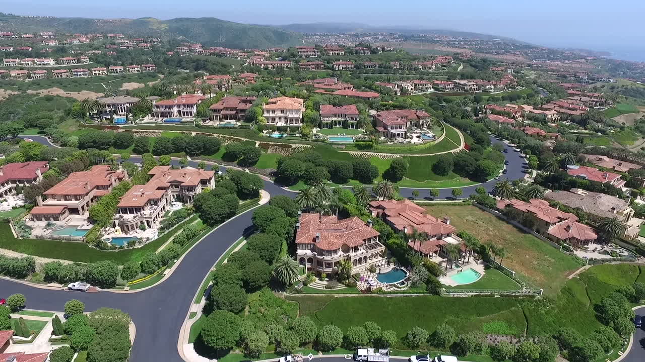 Slow motion aerial drone footage over Pelican Hill in Newport Beach, Orange County, California