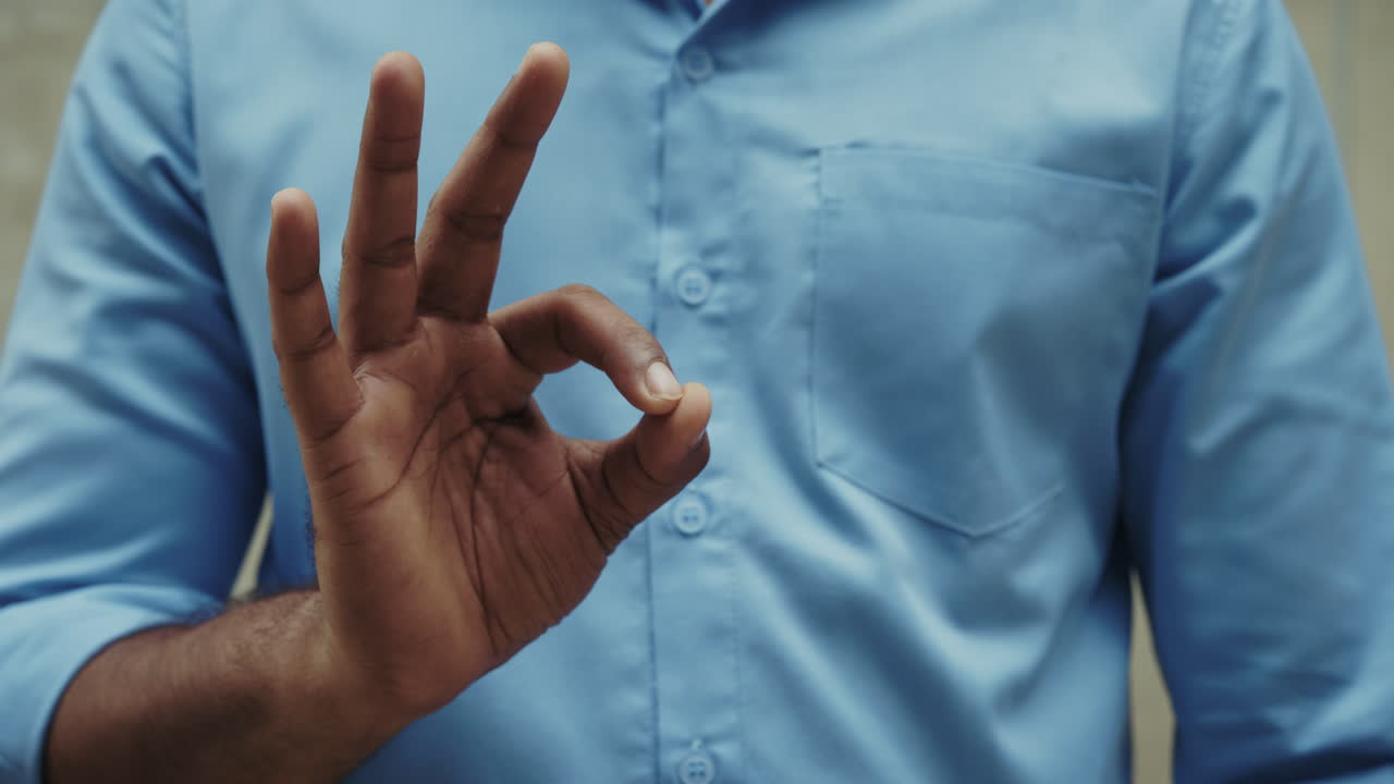 Man making ok hand gesture