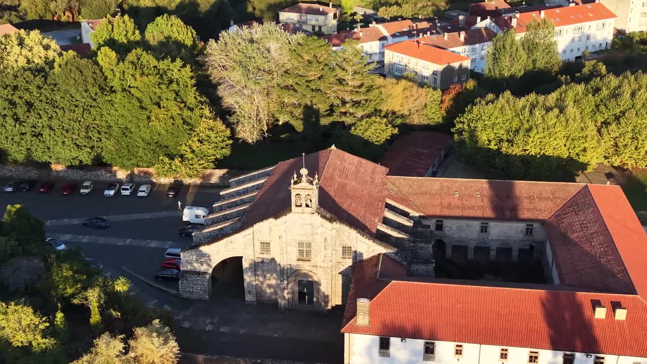 An aerial view of the Collegiate Church of Santa María la Real de Sar. The video, shot with a drone in 4K resolution. A historic Romanesque church located in Santiago de Compostela, Spain