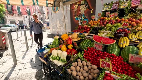 a bustling vegetable stall in naples, italy