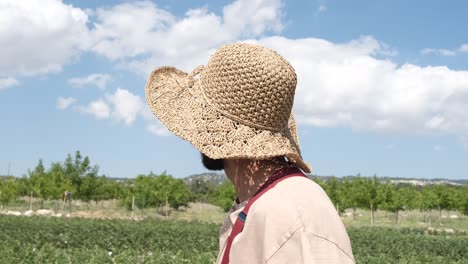 farmer on hat in garden