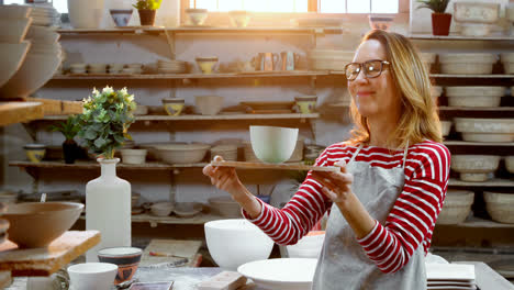 Female-potter-holding-bowl-4k