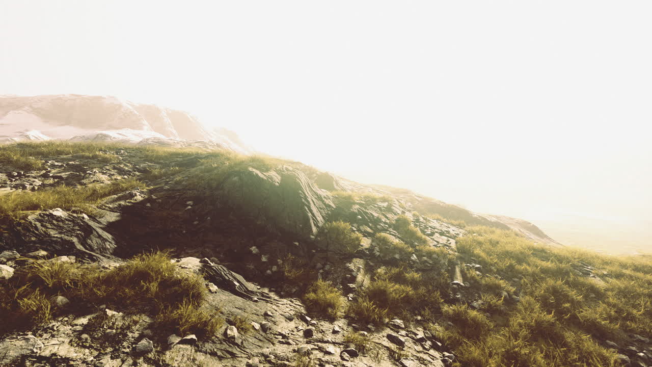 Exploring the serene beauty of a sunlit rocky landscape at dawn